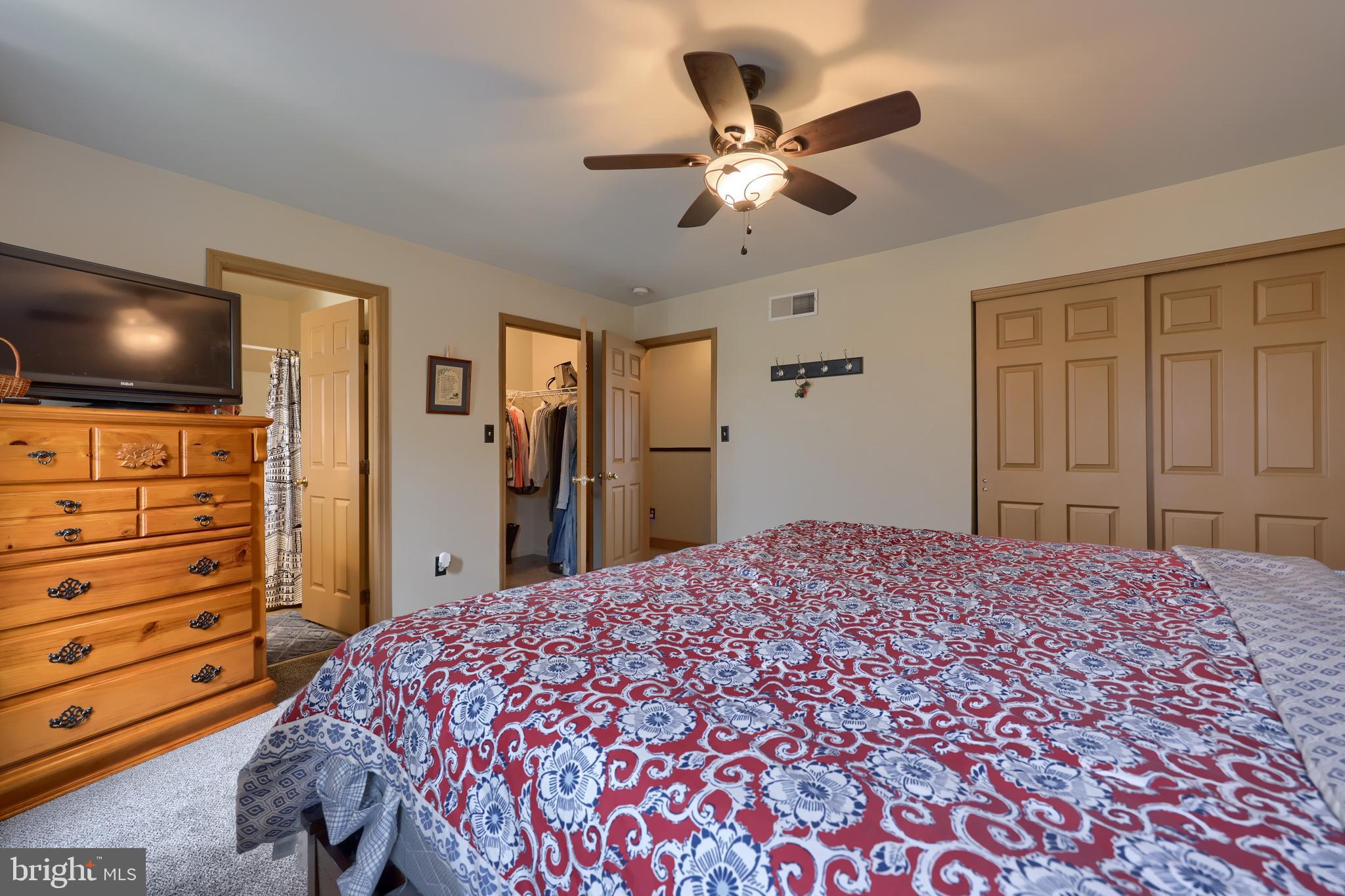 100 Roxberry Drive Reading, PA 19608 - Photo 36 of 46 a bedroom with a bed and a flat screen tv