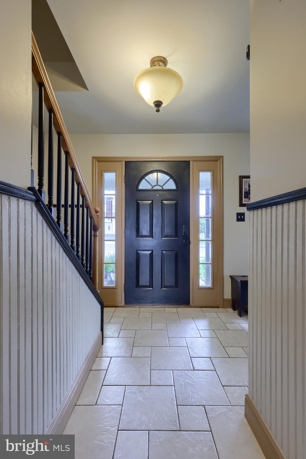 100 Roxberry Drive Reading, PA 19608 - Photo 6 of 46 a view of a hallway with entryway windows wooden floor and front door