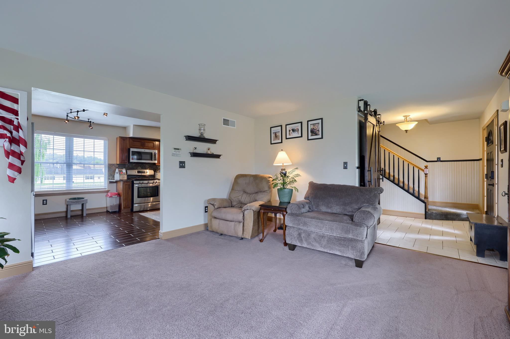 100 Roxberry Drive Reading, PA 19608 - Photo 9 of 46 a living room with furniture and a flat screen tv