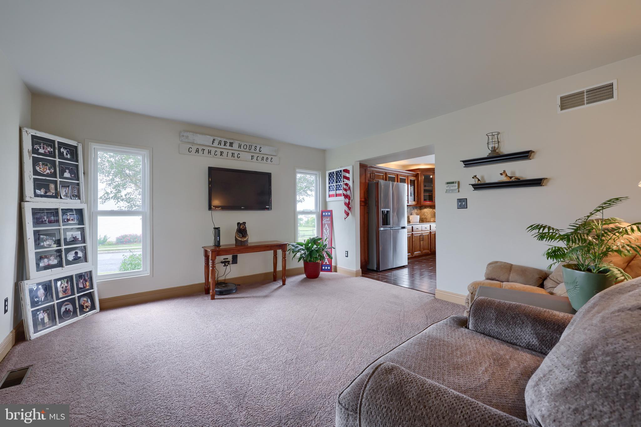 100 Roxberry Drive Reading, PA 19608 - Photo 10 of 46 a living room with furniture and a flat screen tv