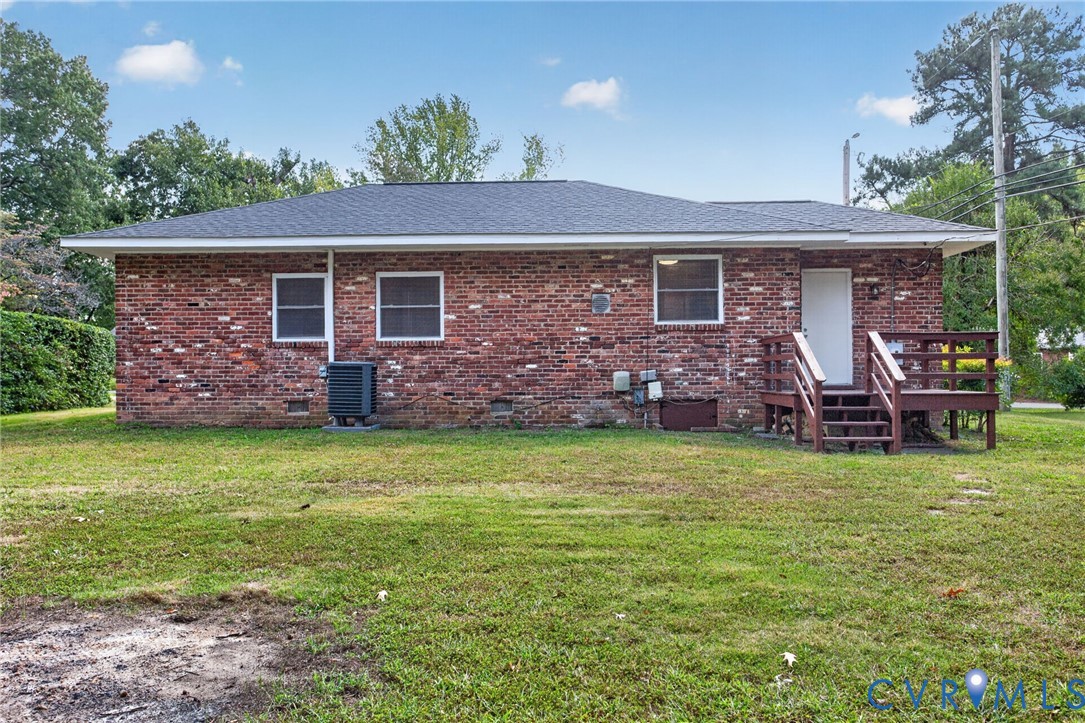 1118 Andros Road Richmond, VA 23225 - Photo 28 of 28 Brick exterior with dark shingle roofing