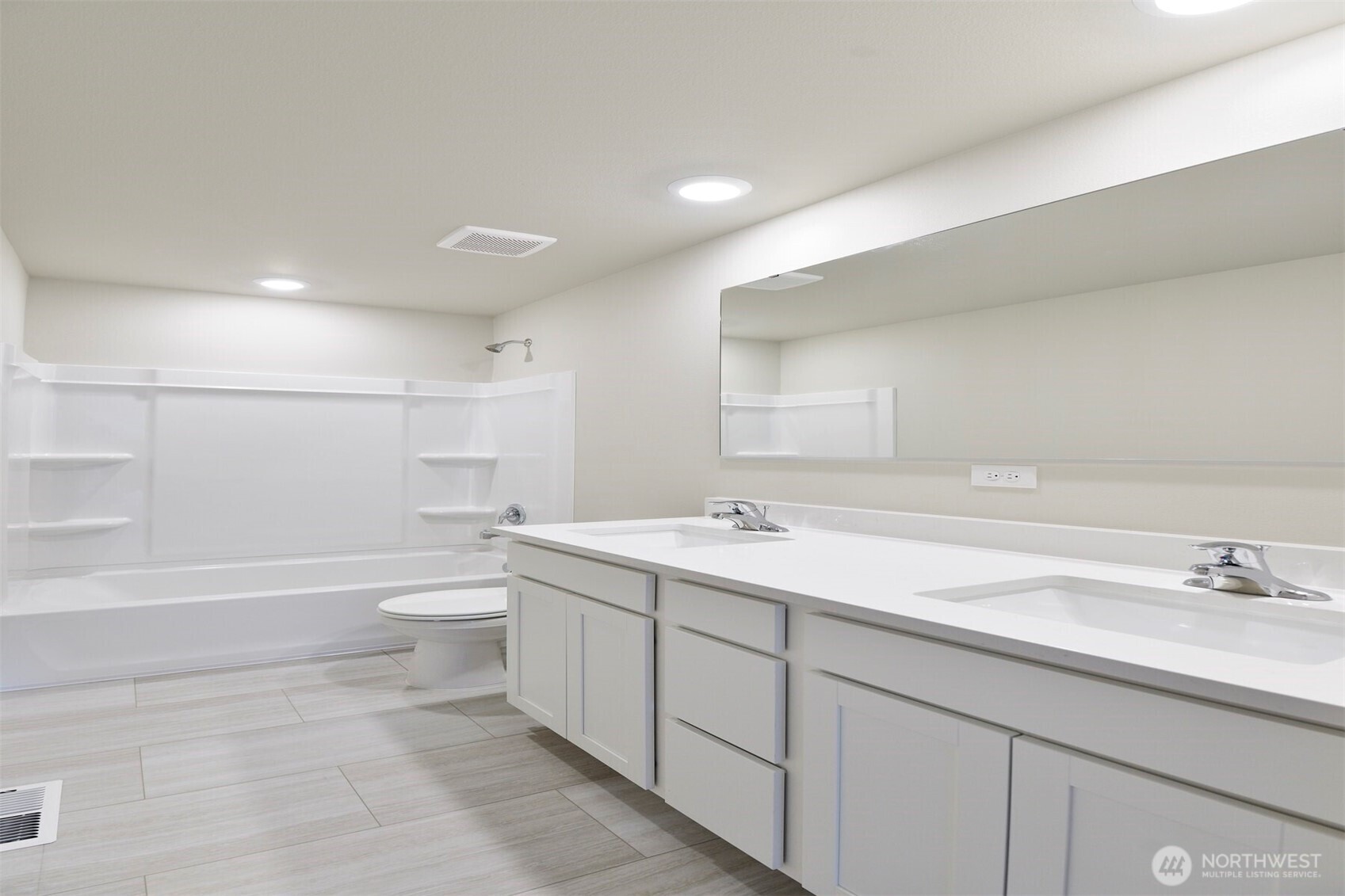 9732 Hay Street Southeast Yelm, WA 98597 - Photo 7 of 10 a bathroom with a sink a toilet and shower