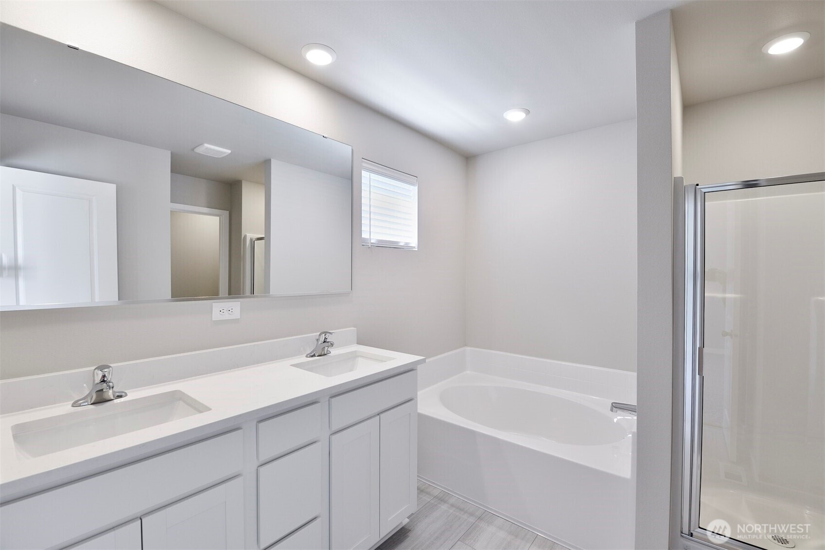 9732 Hay Street Southeast Yelm, WA 98597 - Photo 9 of 10 a bathroom with a bathtub a sink and a mirror