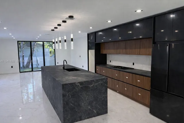 a bathroom with a sink a vanity and a large mirror
