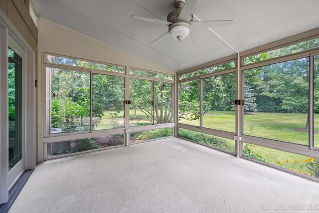 a view of room with window and ceiling fan