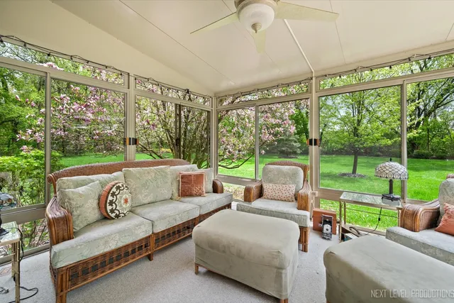 a balcony with furniture and garden view