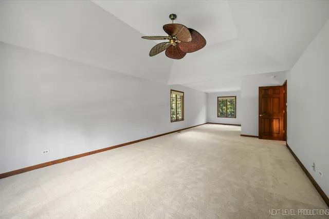a view of a livingroom with wooden floor and electronic appliances