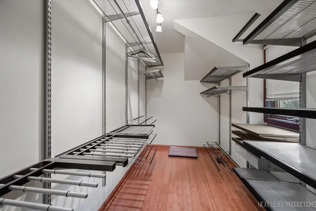a spacious bathroom with a tub double sink and mirror
