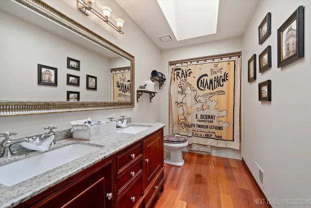 an empty room with a window and a ceiling fan