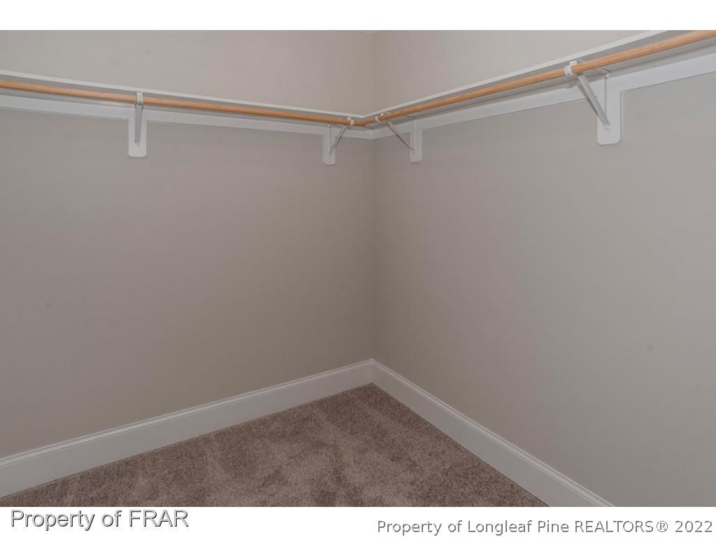 475 Kerr Lake Road Aberdeen, NC 28315 - Photo 12 of 29 a view of a room with racks on the wall