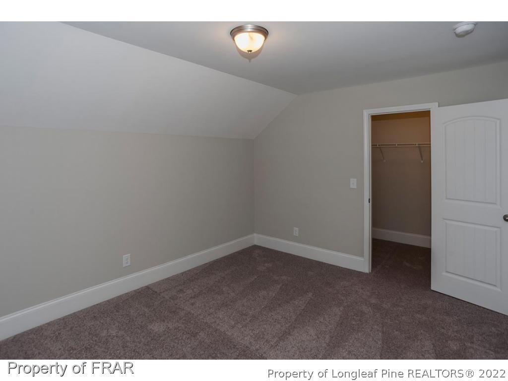 475 Kerr Lake Road Aberdeen, NC 28315 - Photo 25 of 29 a view of an empty room and window