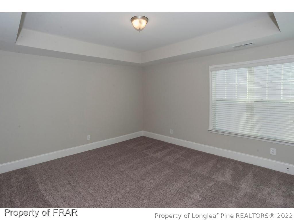 475 Kerr Lake Road Aberdeen, NC 28315 - Photo 29 of 29 a view of an empty room with a window