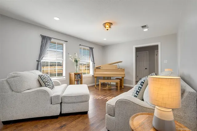 a living room with furniture and a table