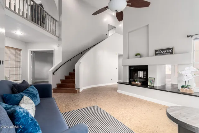 a kitchen with stainless steel appliances granite countertop a refrigerator a sink dishwasher a stove and a refrigerator with wooden floor