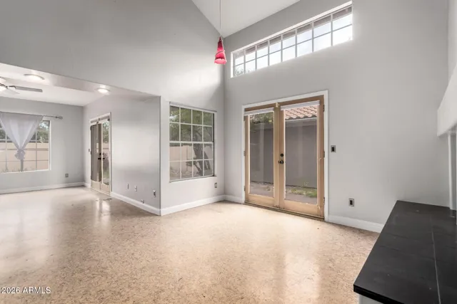 a kitchen with stainless steel appliances granite countertop a refrigerator a stove and a sink