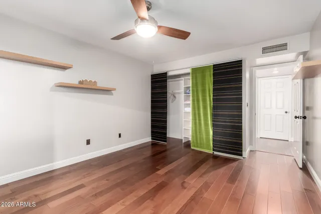 a view of an empty room with a fireplace