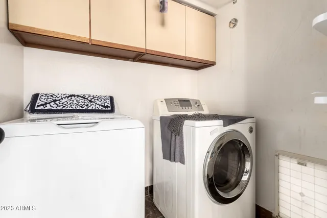 a large kitchen with stainless steel appliances granite countertop a sink and a stove
