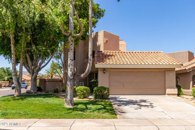 a view of a room with wooden floor and a window