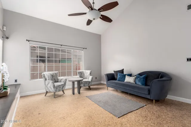 a workspace room with furniture and window