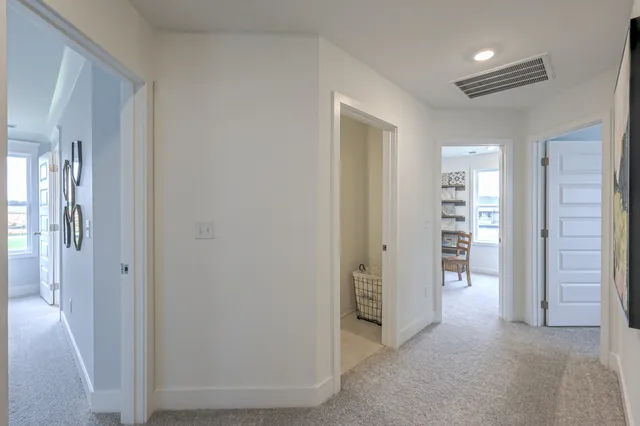 a bedroom with a bed and a lamp