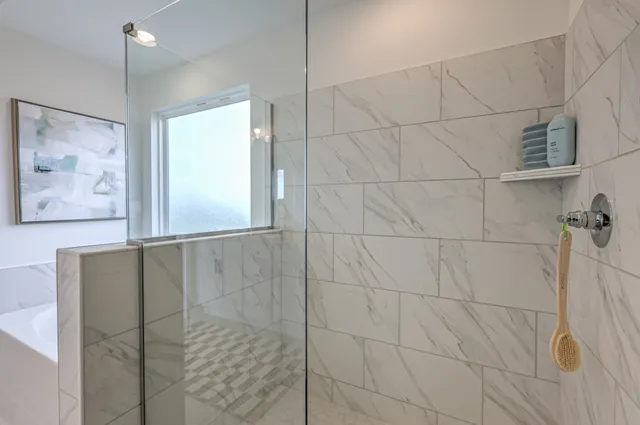 a kitchen with stainless steel appliances granite countertop a dining table chairs refrigerator sink and cabinets