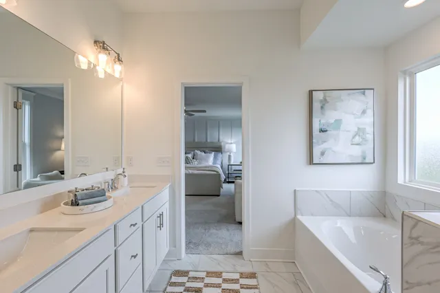 a kitchen with a sink a counter space appliances and cabinets