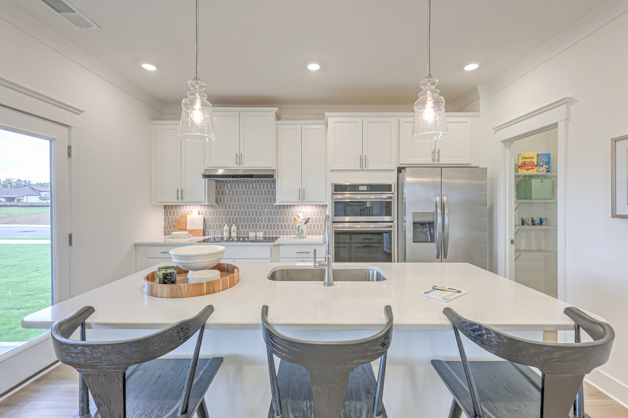537 Misty Creek Nashville, TN 37207 - Photo 50 of 64 a kitchen with stainless steel appliances kitchen island granite countertop a dining table chairs refrigerator and sink