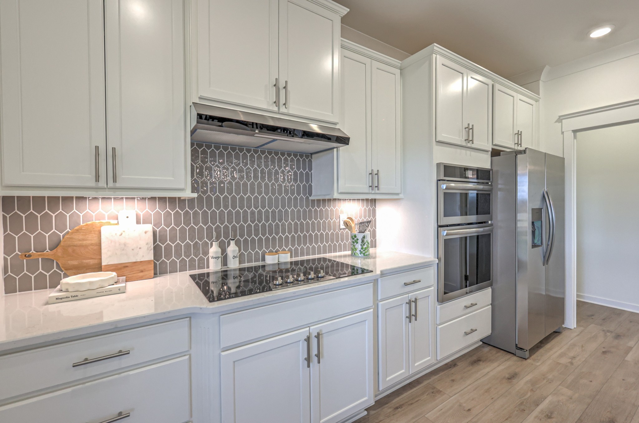 537 Misty Creek Nashville, TN 37207 - Photo 53 of 64 a kitchen with white cabinets and stainless steel appliances