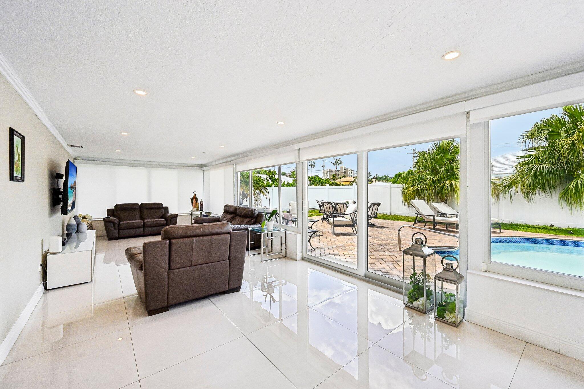 2940 Northeast 39th Court Lighthouse Point, FL 33064 - Photo 14 of 42 a living room with furniture and a large window