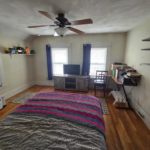 a bed room with a bed and furniture