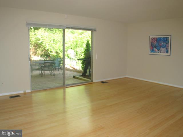 9247 Three Oaks Drive Silver Spring, MD 20901 - Photo 3 of 30 a view of an empty room with a window