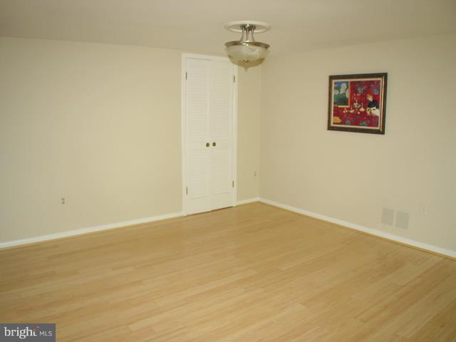 9247 Three Oaks Drive Silver Spring, MD 20901 - Photo 26 of 30 an empty room with a ceiling fan