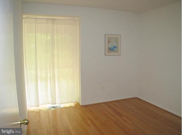 9247 Three Oaks Drive Silver Spring, MD 20901 - Photo 30 of 30 a view of an empty room and window