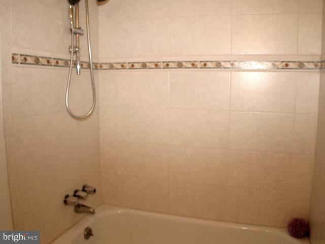 9247 Three Oaks Drive Silver Spring, MD 20901 - Photo 10 of 30 a bathroom with a shower