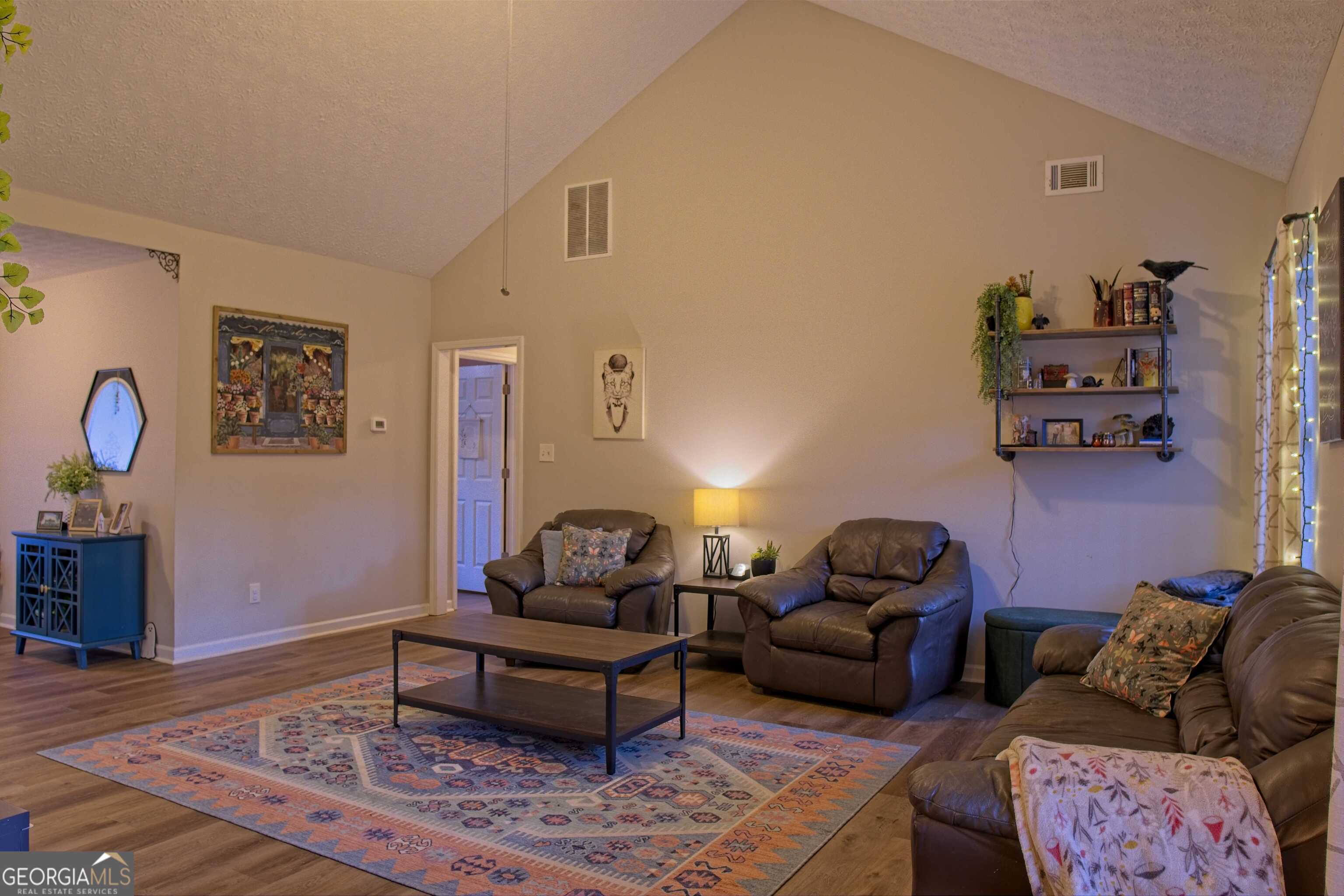 705 Baker Road Oxford, GA 30054 - Photo 11 of 50 a living room with furniture and wooden floor