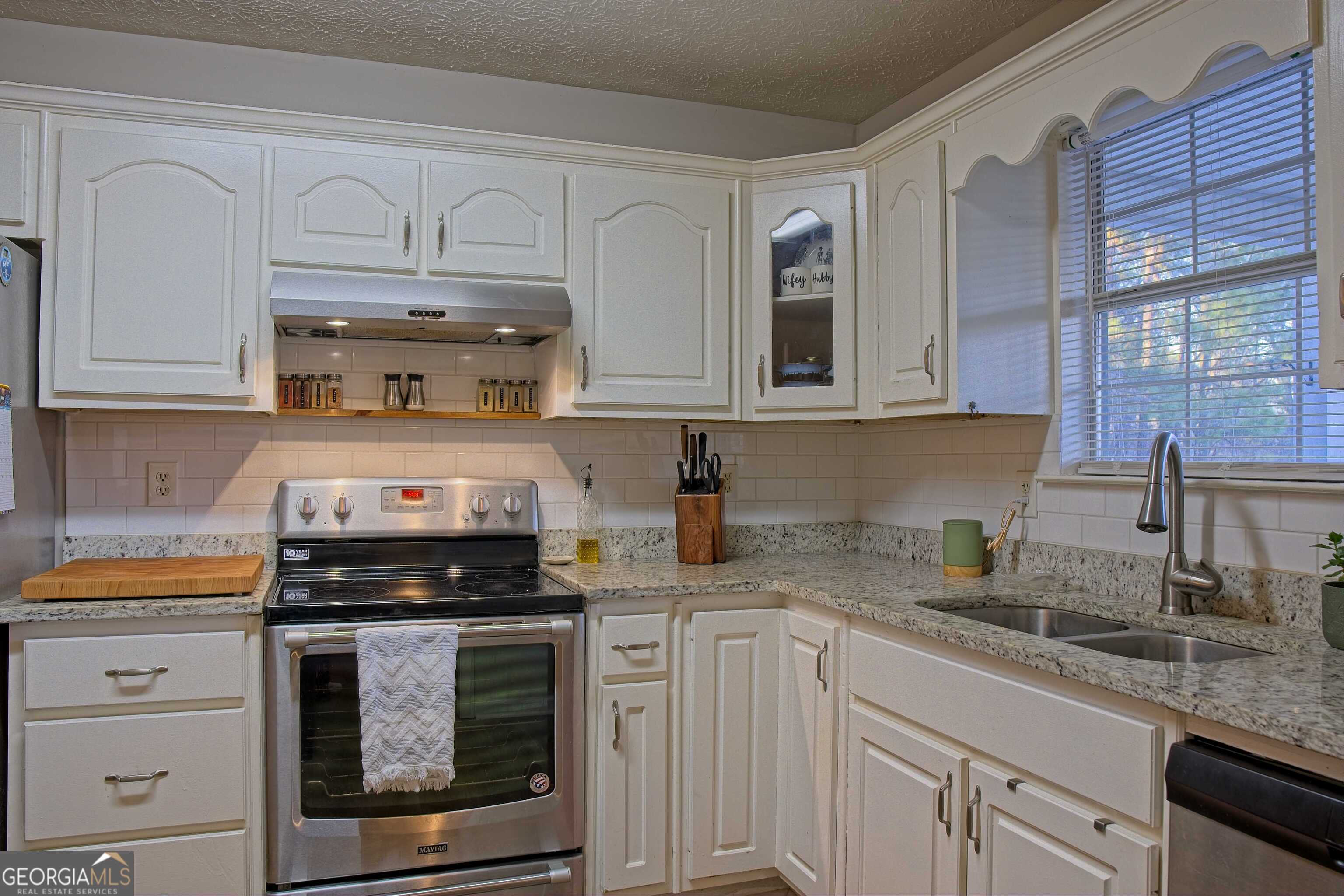 705 Baker Road Oxford, GA 30054 - Photo 14 of 50 a kitchen with cabinets appliances and a sink