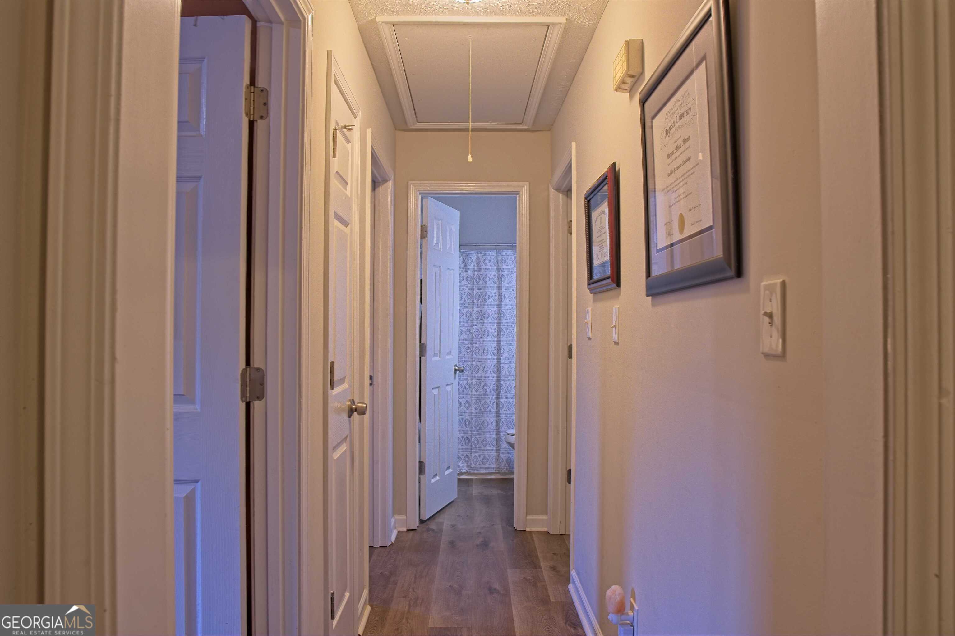 705 Baker Road Oxford, GA 30054 - Photo 21 of 50 a view of a hallway with wooden floor and staircase