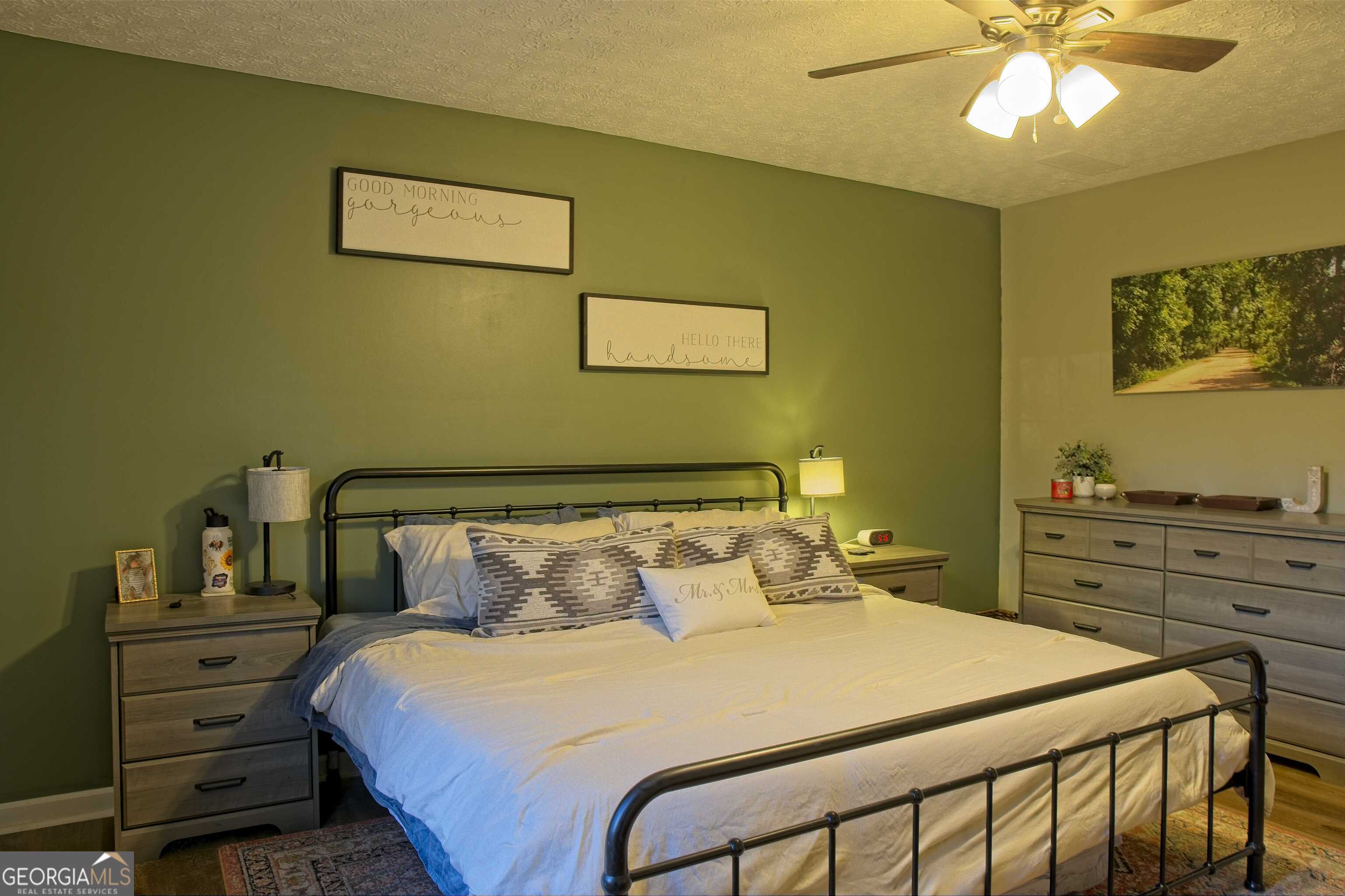 705 Baker Road Oxford, GA 30054 - Photo 26 of 50 a bedroom with a bed and a tv on the dresser