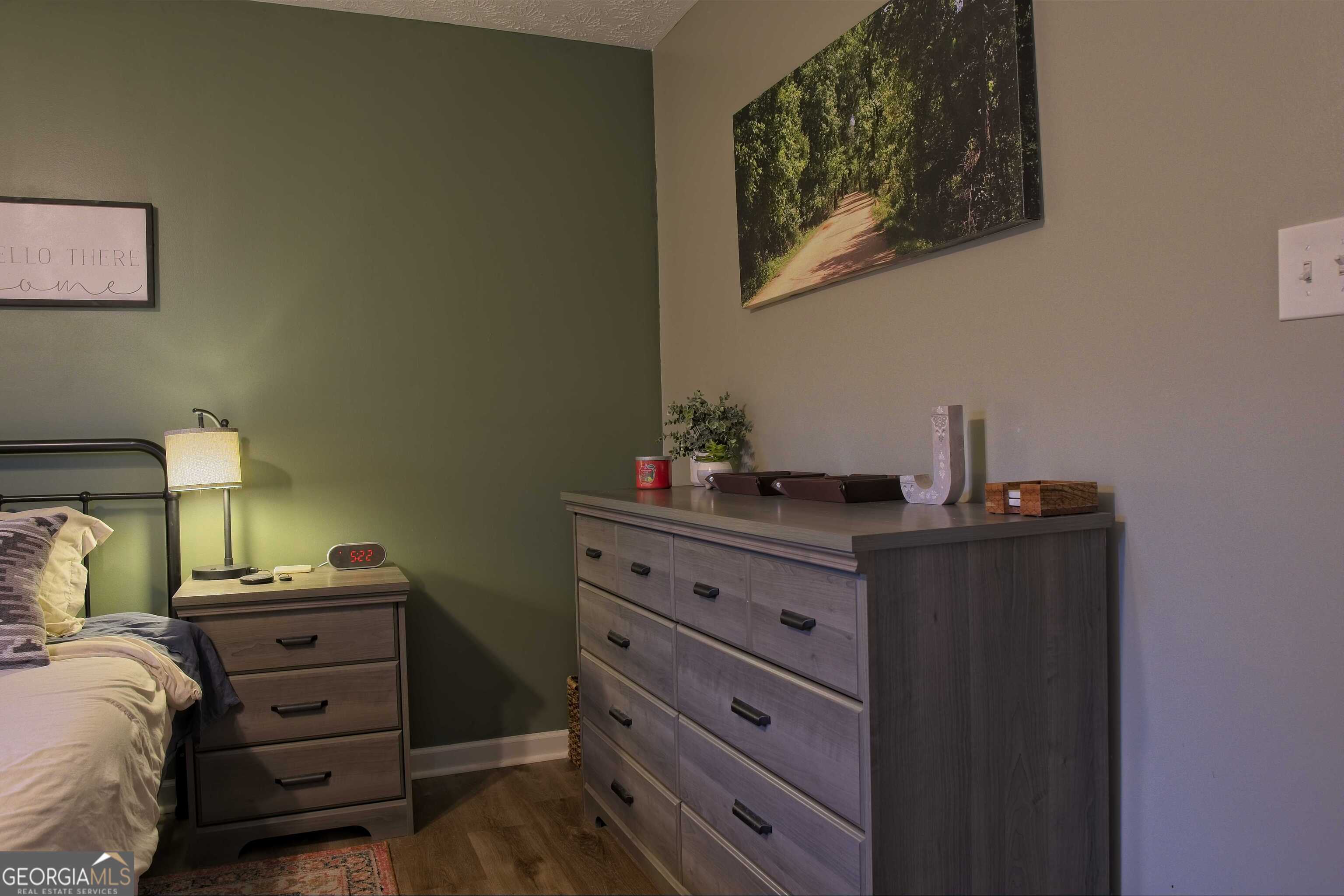 705 Baker Road Oxford, GA 30054 - Photo 27 of 50 a bed room with a bed and a desk