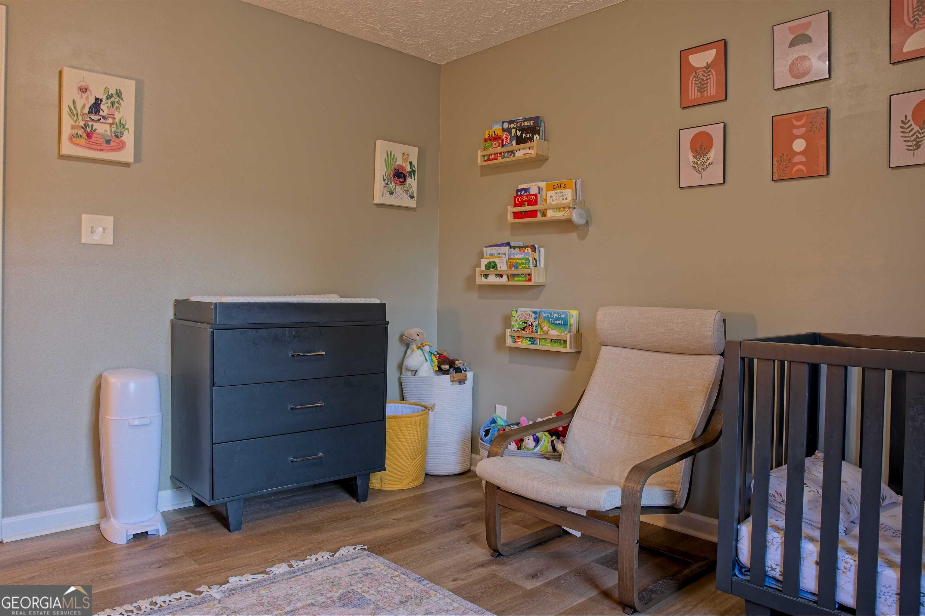705 Baker Road Oxford, GA 30054 - Photo 37 of 50 a room with furniture and a dresser