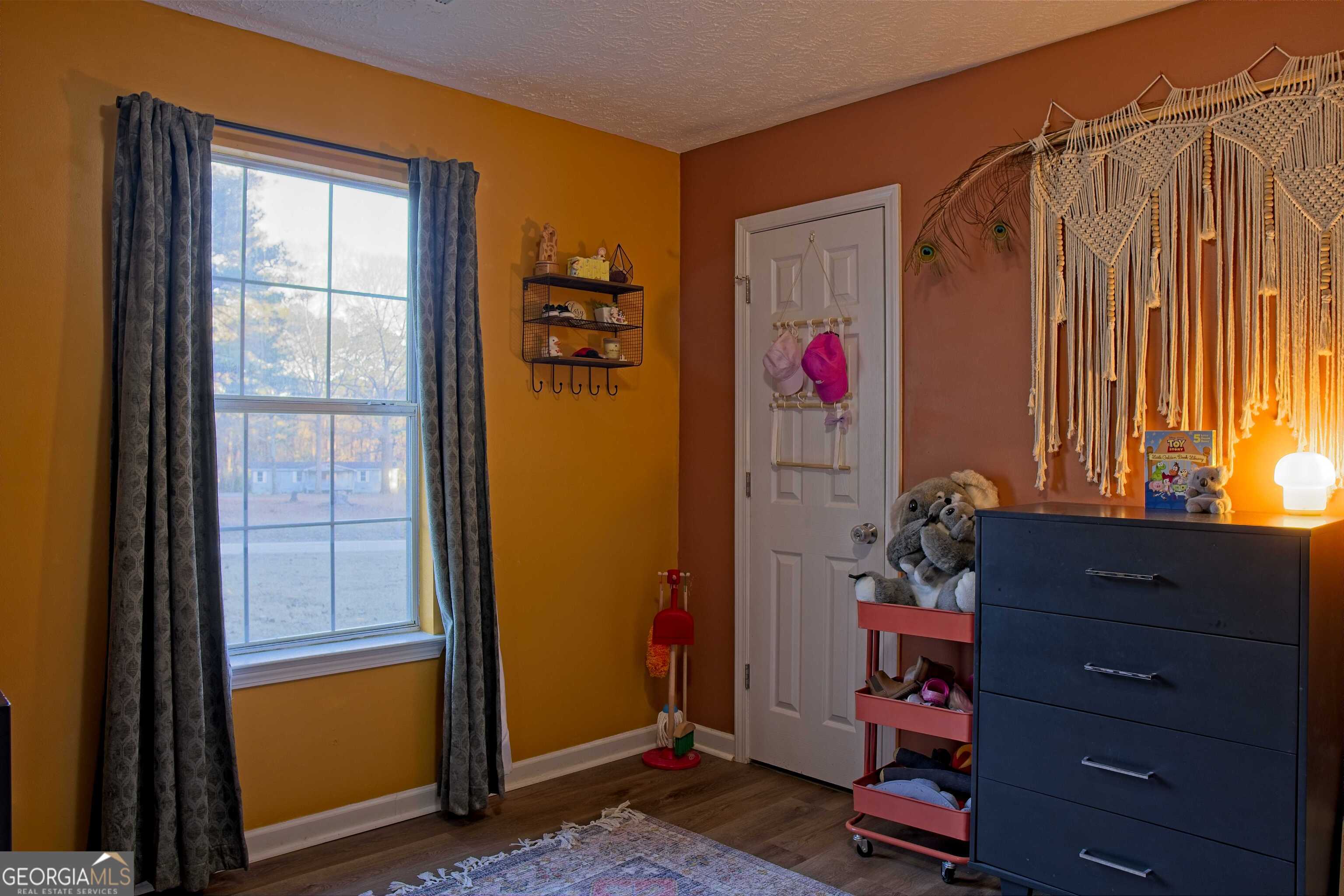 705 Baker Road Oxford, GA 30054 - Photo 38 of 50 a room with toys and a window