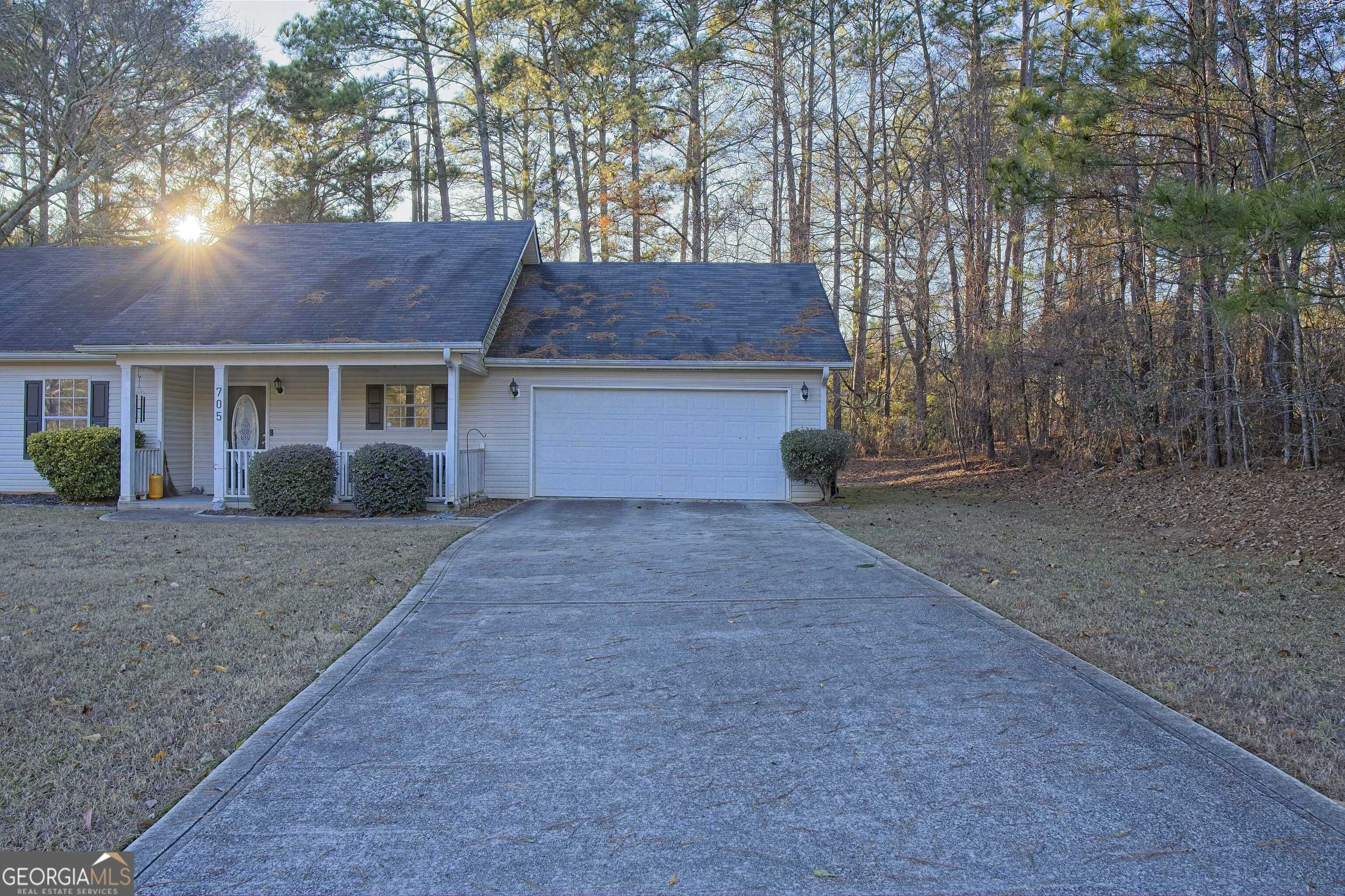 705 Baker Road Oxford, GA 30054 - Photo 4 of 50 front view of a house with a yard and an trees