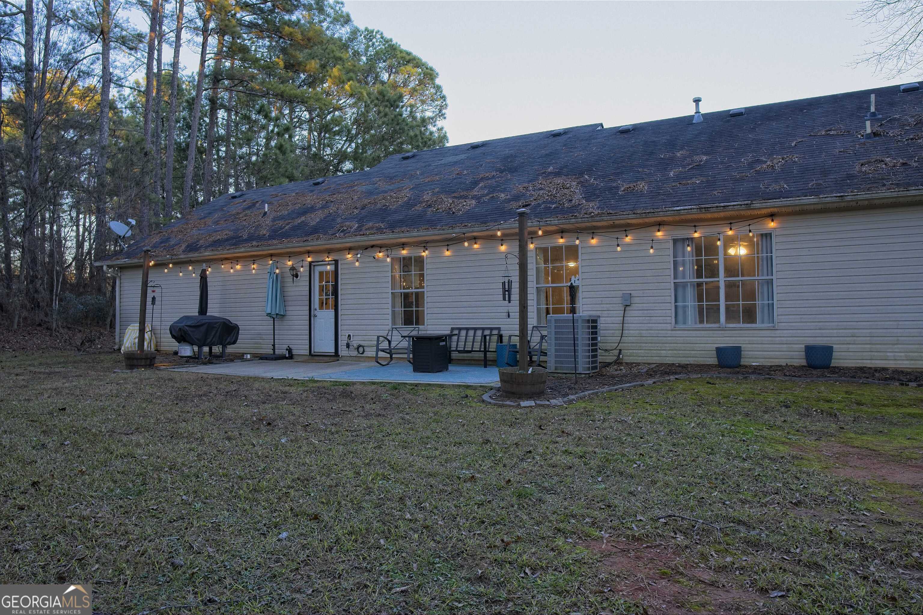 705 Baker Road Oxford, GA 30054 - Photo 44 of 50 a view of a house with a back yard
