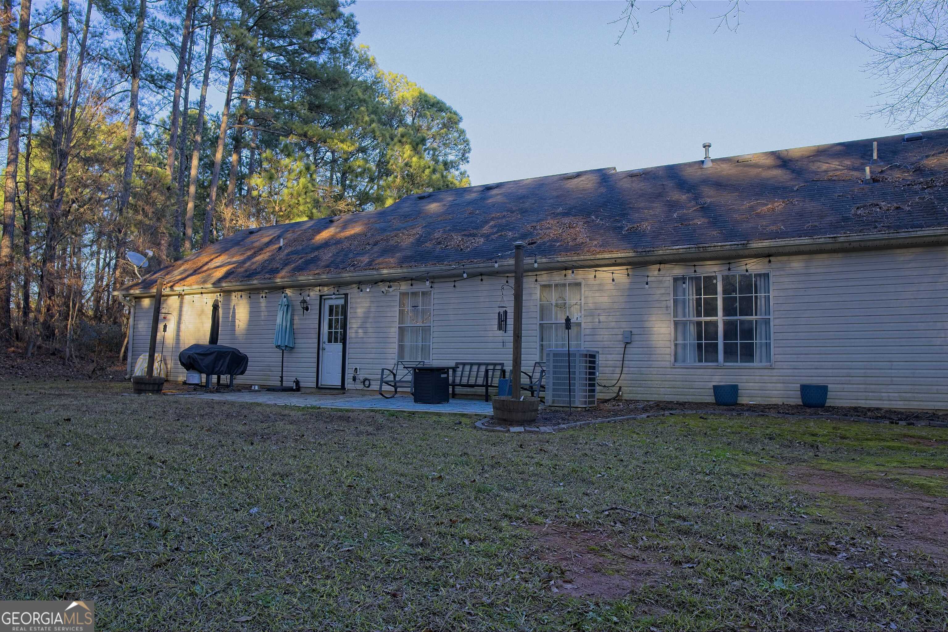 705 Baker Road Oxford, GA 30054 - Photo 47 of 50 a house view with a sitting space and garden