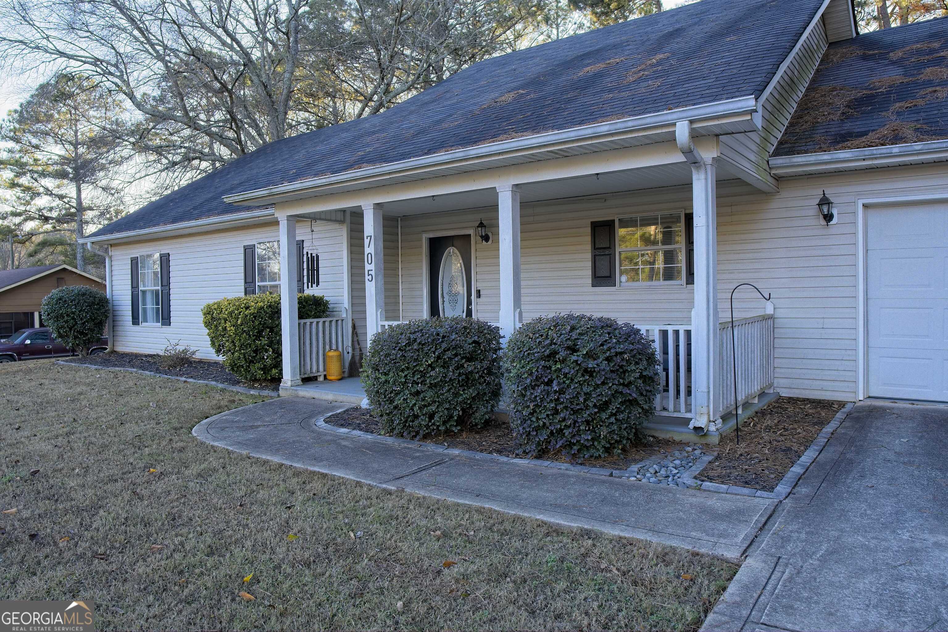 705 Baker Road Oxford, GA 30054 - Photo 6 of 50 a view of a house with backyard and plants