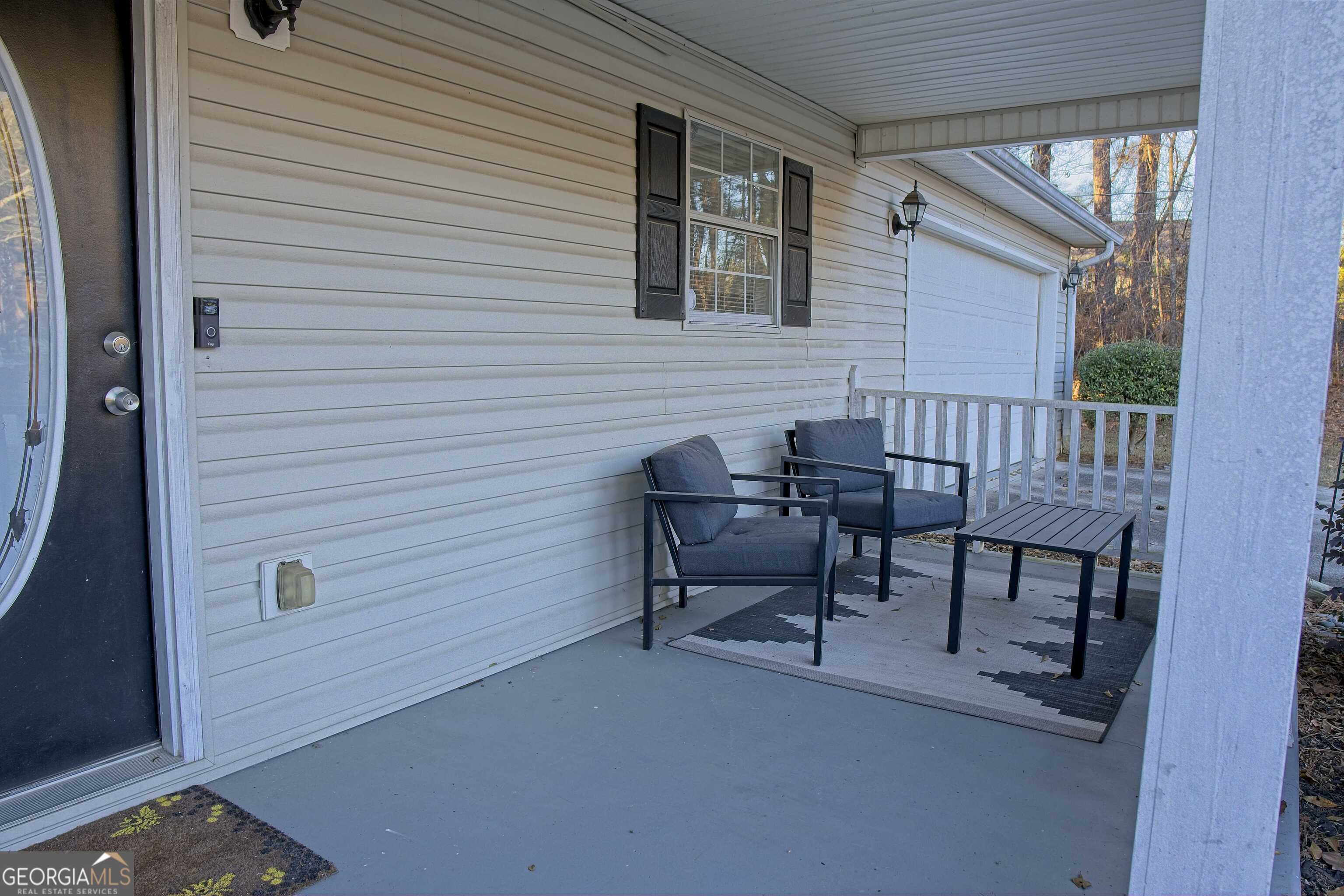 705 Baker Road Oxford, GA 30054 - Photo 8 of 50 a view of a house with backyard and sitting area