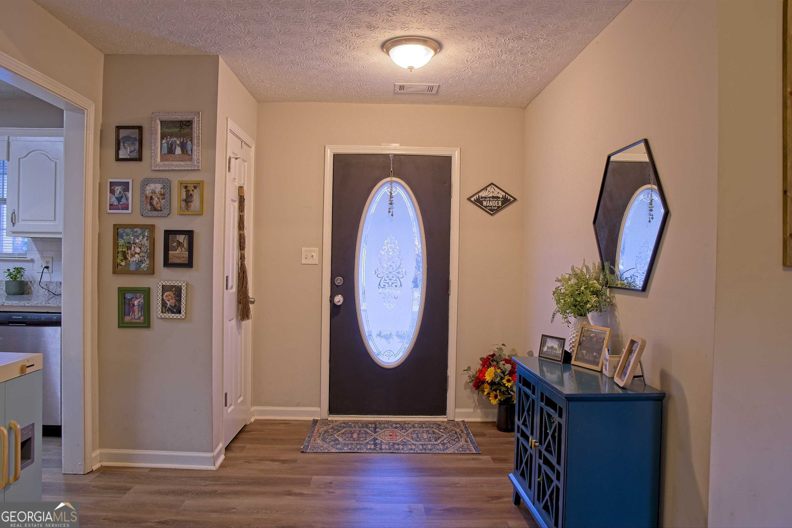 705 Baker Road Oxford, GA 30054 - Photo 9 of 50 a view of a livingroom with furniture and wooden floor