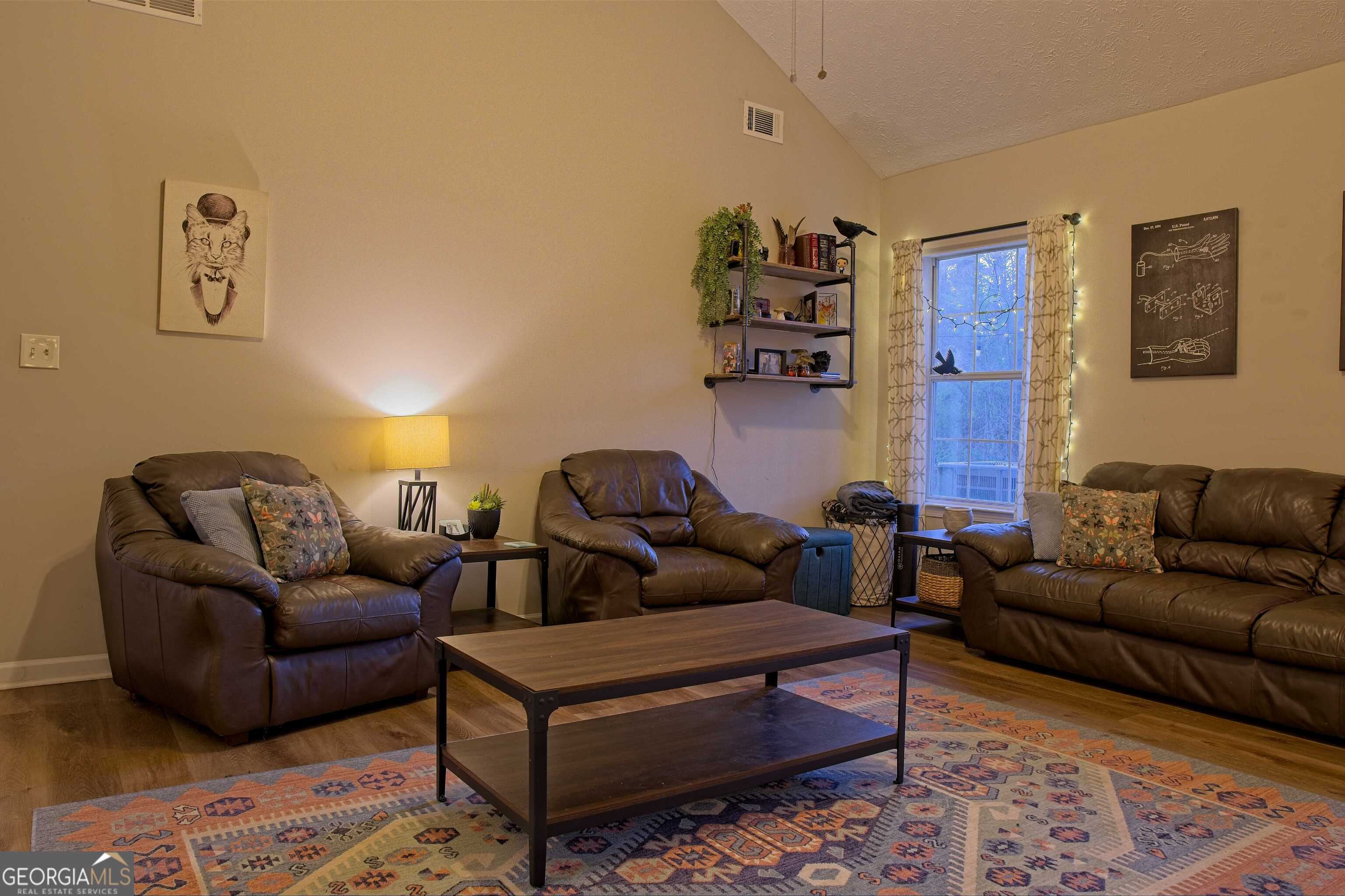 705 Baker Road Oxford, GA 30054 - Photo 10 of 50 a living room with furniture and a couch