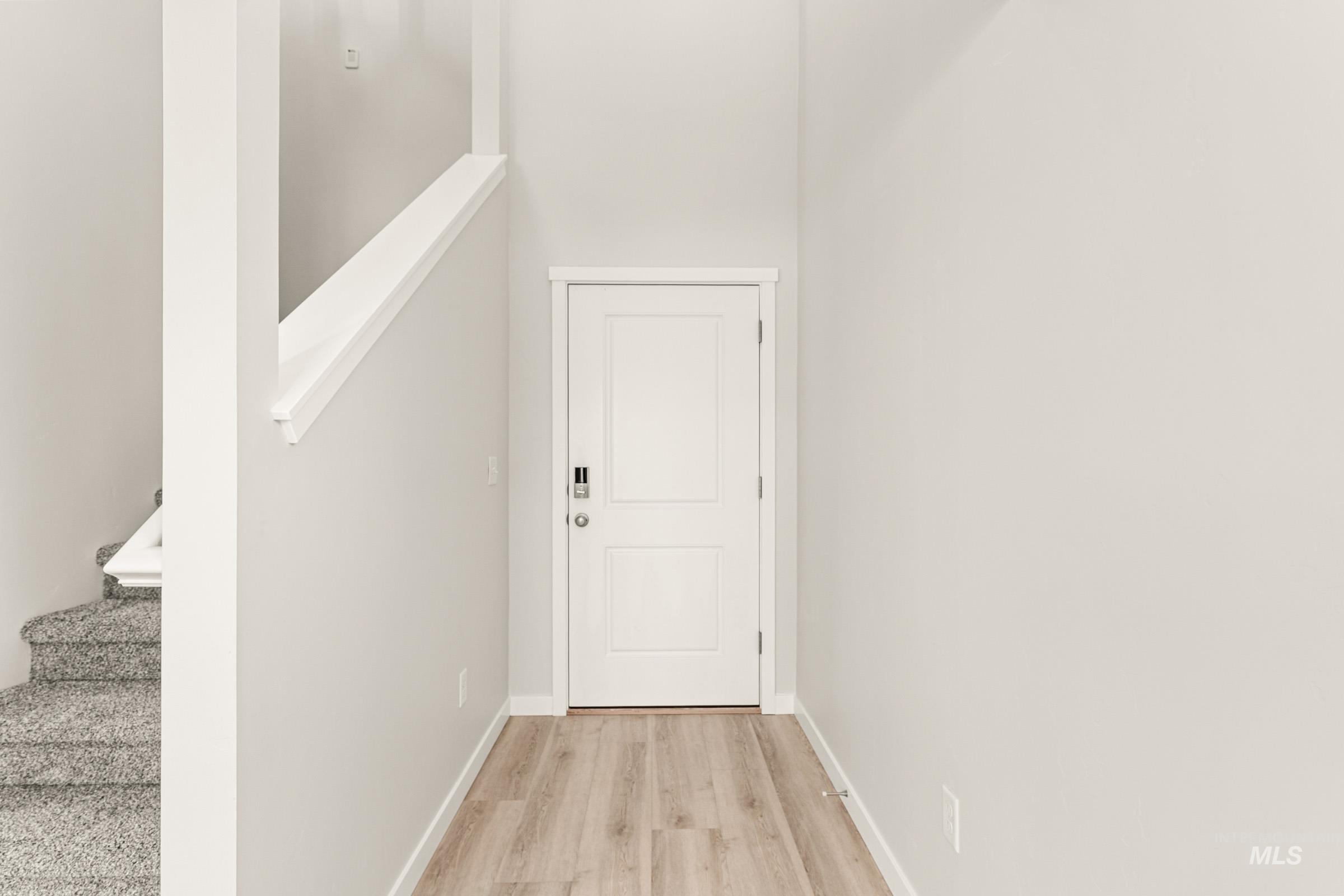 10832 Rutland Street Caldwell, ID 83605 - Photo 2 of 20 Entryway featuring stairs and wood finished floors