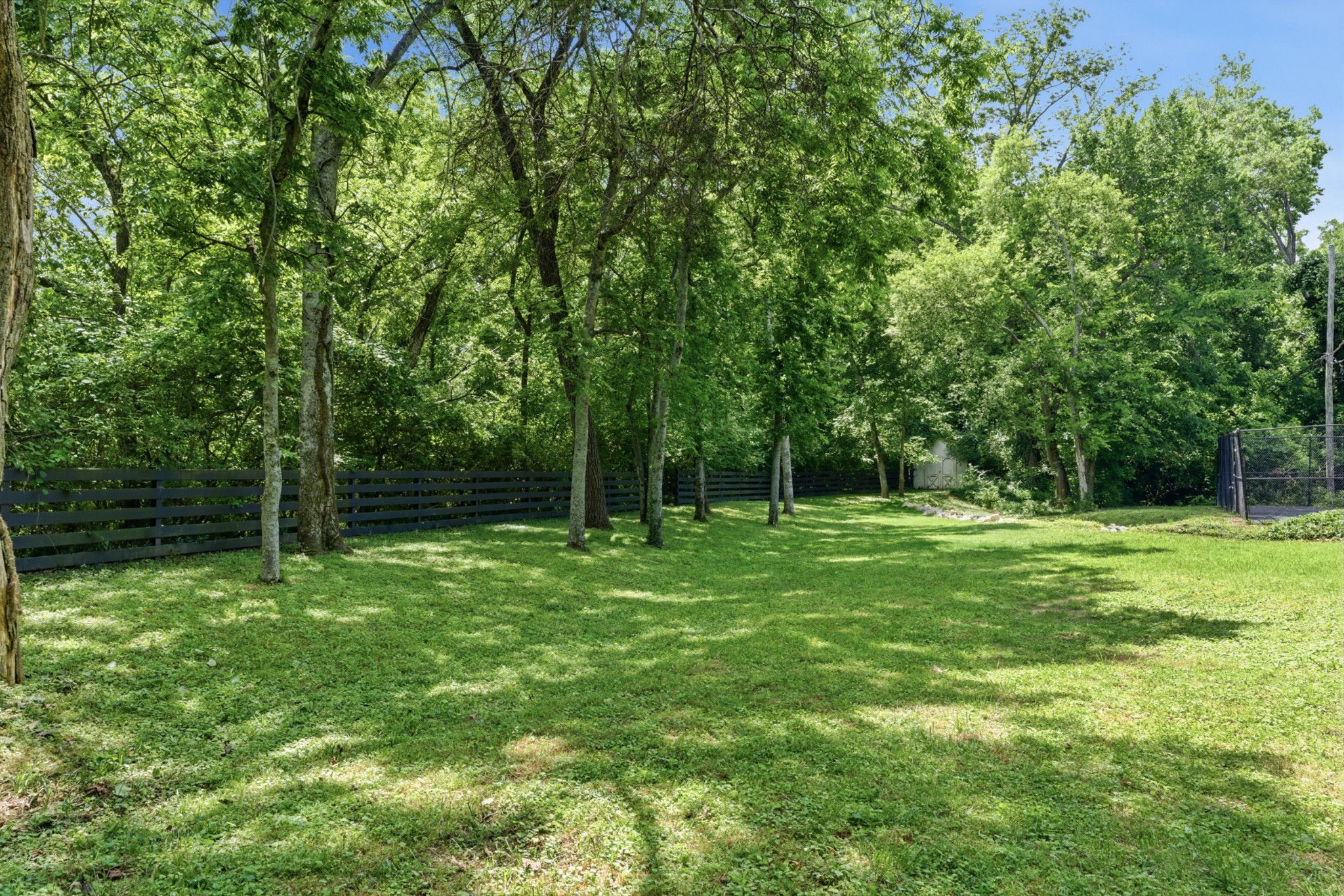 2419 Valley Brook Road Nashville, TN 37215 - Photo 17 of 80 a view of a grassy field with trees in the background